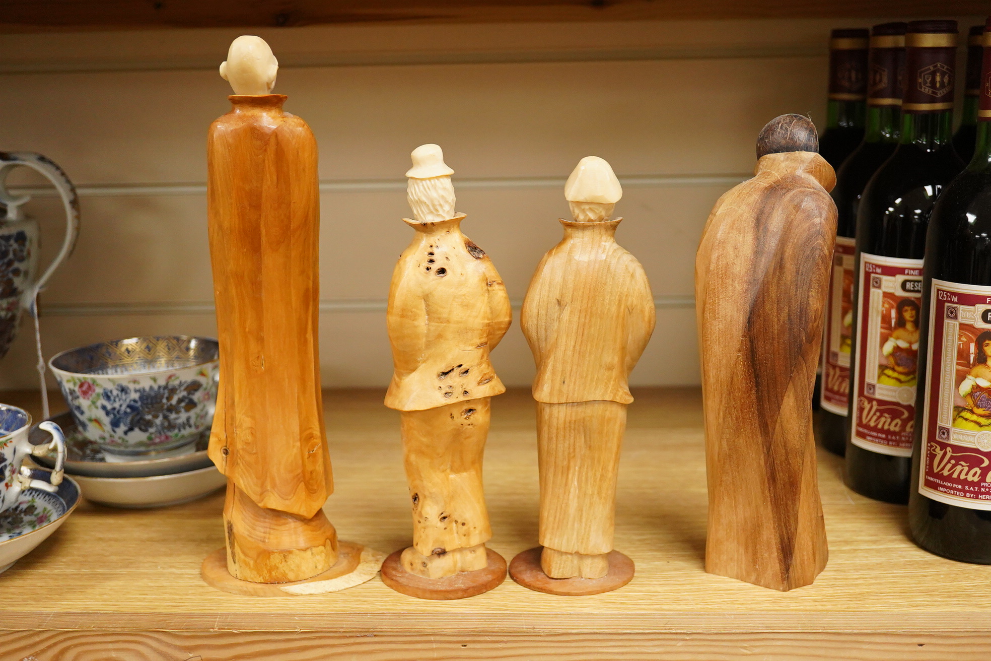 Pierre Decorse (b.1953), a group of four carved figures, tallest 29cm high